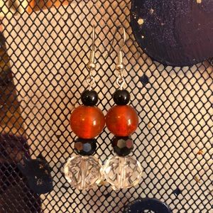 Handmade orange black and clear beaded earrings